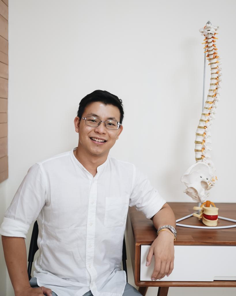 Chiropractor with a replicate of a backbone
